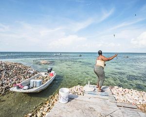Women fishing on the shore.