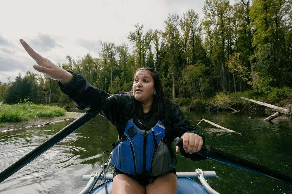 Shanti Tallio-Milton, a Nuxalk river guide, rows a raft on a bear viewing drift, on the Atnarko River, a tributary of the Bella Coola River, in Bella Coola, Canada.